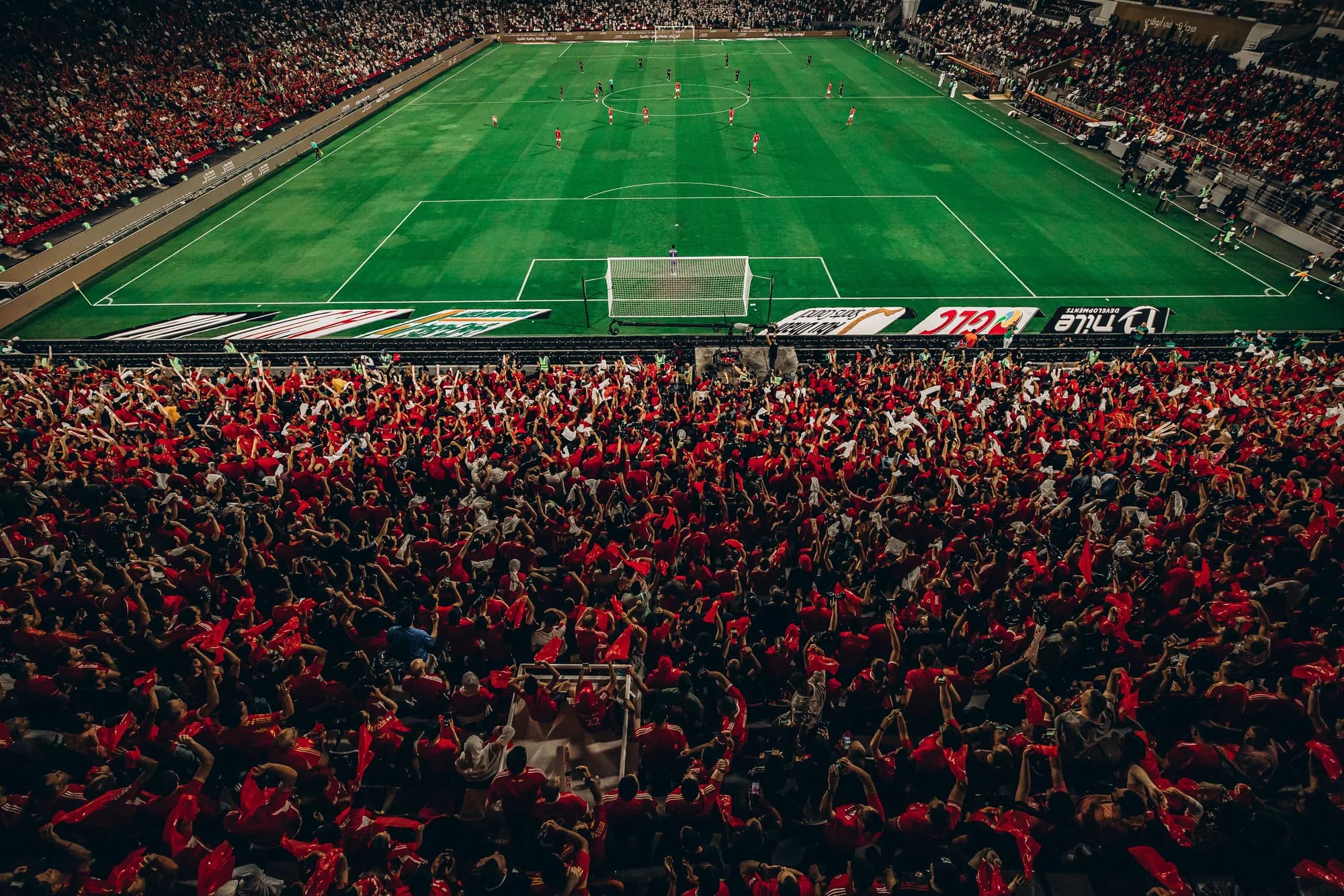 Supporters filling a stand behind the goal before kick-off